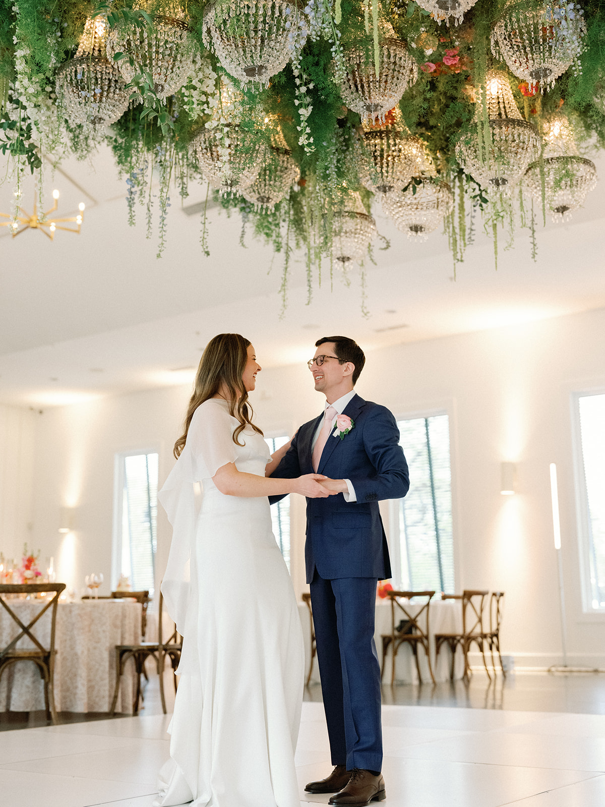 Bride & groom dancing at their wedding reception at The Hutton House.