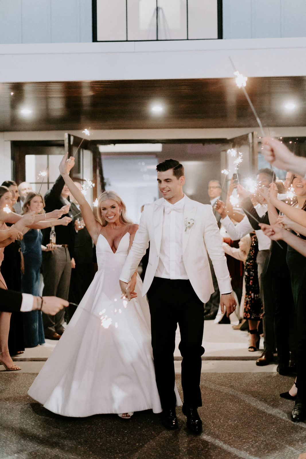 Chic white wedding ending in a sparkler send-off