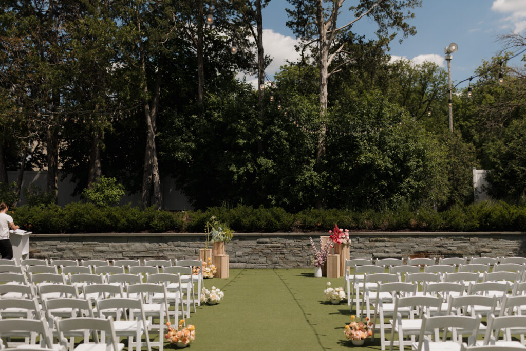 Summer wedding ceremony hosted in The Hutton House courtyard