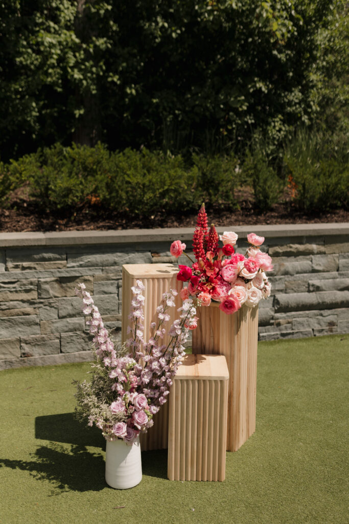 Bold florals adorned this summer wedding ceremony in The Hutton House courtyard