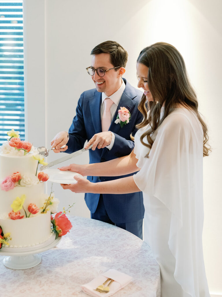 Bride & groom cut their wedding cake at their Hutton House wedding reception.