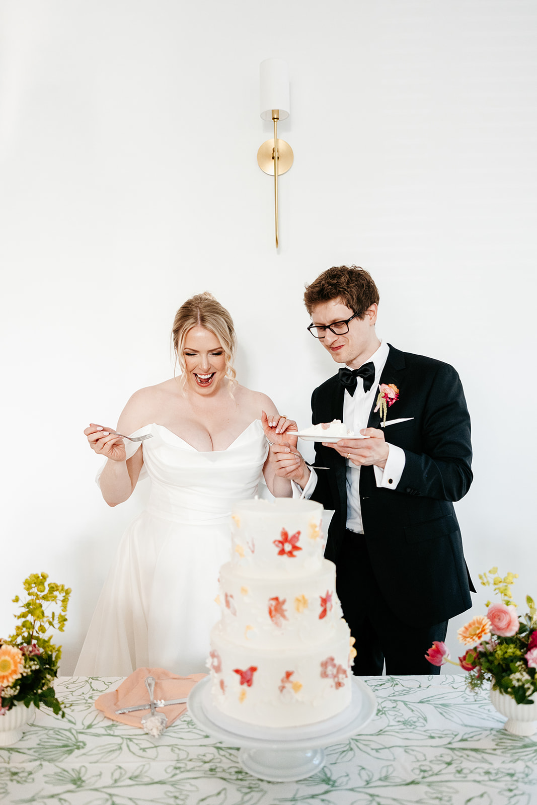 Bride and groom cutting their cake at The Hutton House wedding reception Luxury Minnesota Wedding Venue
